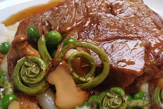 Veal with fiddlehead and shiatake sauce 