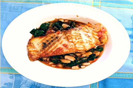 Roasted salmon with white beans tomato and spinach 