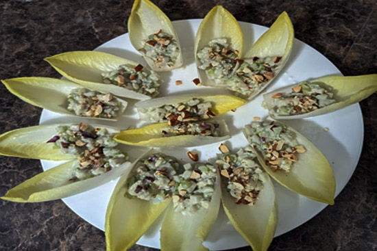 Apple blue cheese and hazelnut salad on endive leaves 