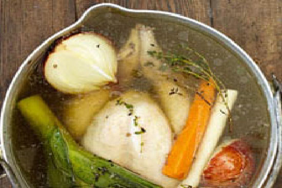 Chicken pot au feu with carrots potatoes and leeks 