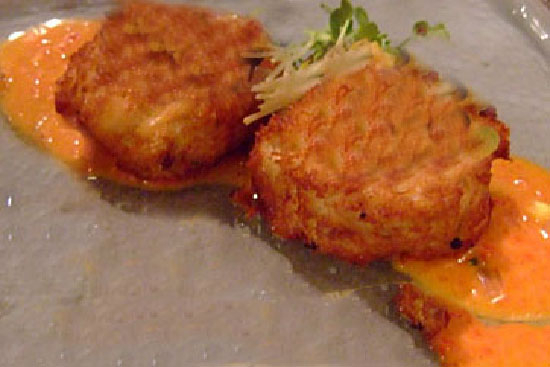 Crab and lobster cakes with roasted red pepper coulis and dill cream 
