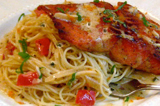 Cajun salmon fillet grenobloise with angel hair pasta 