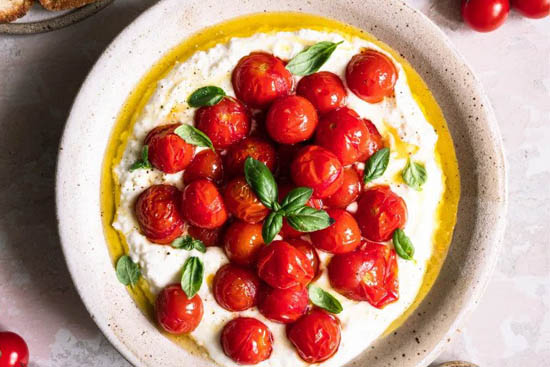 Honey-roasted cherry tomatoes on whipped feta 